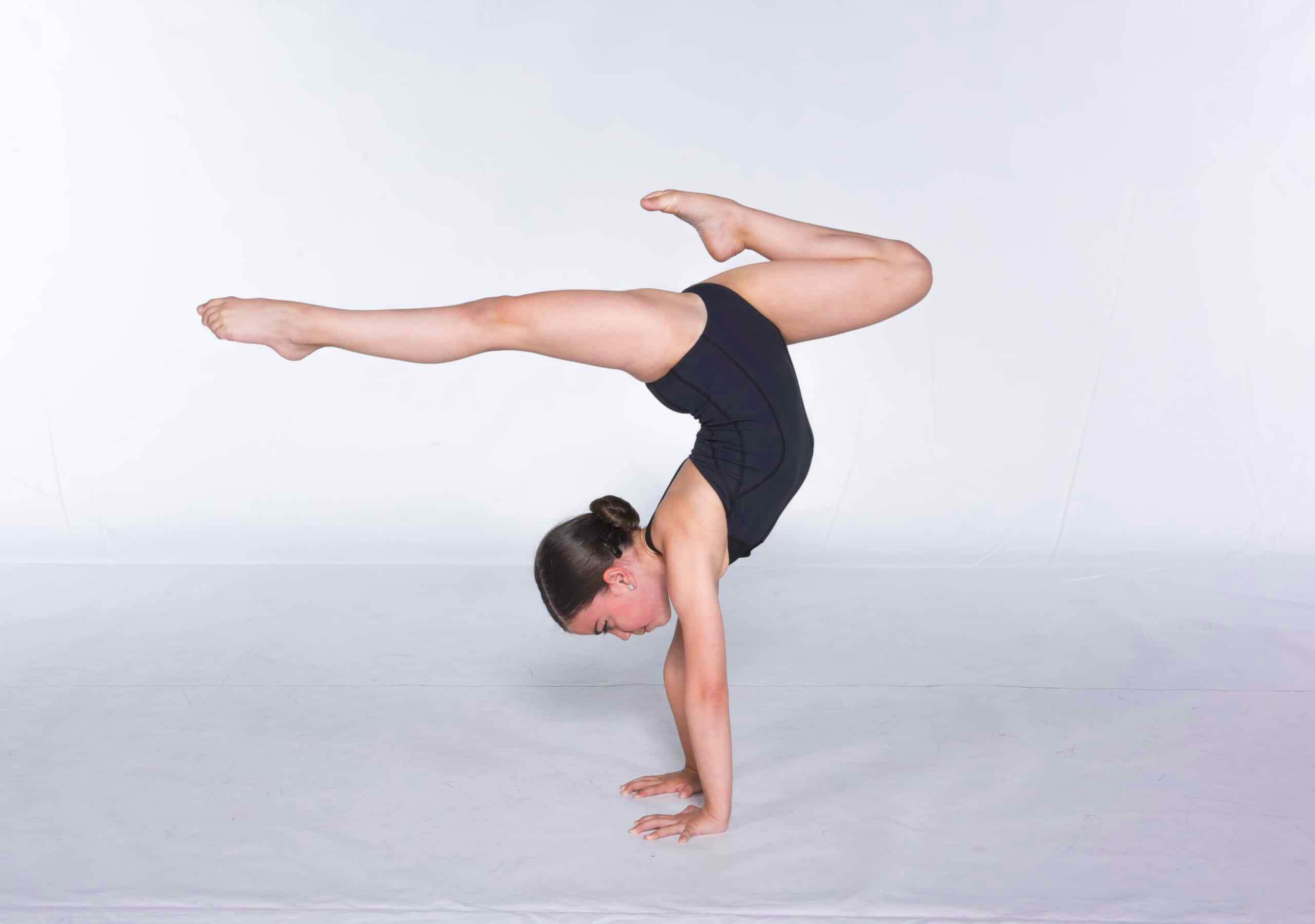 professional acrobatic dancer performing aerial flips on stage